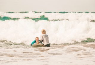 surf beginner lesson in the water