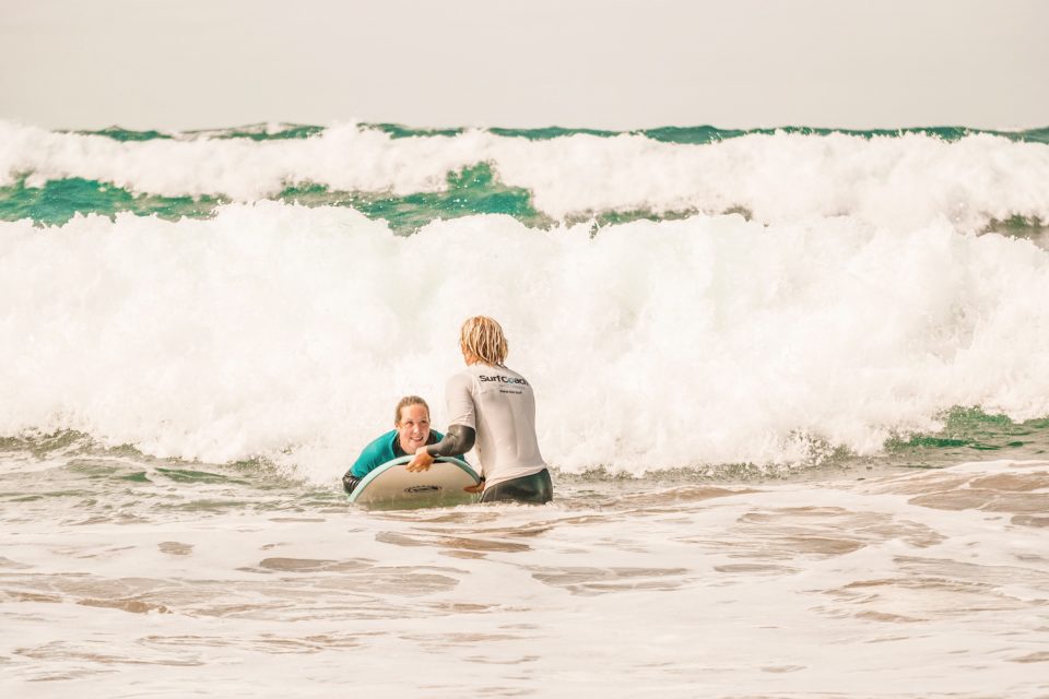 surf beginner lesson in the water